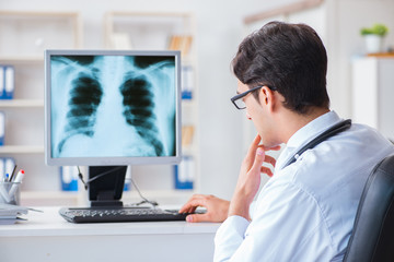 Doctor radiologist looking at x-ray images