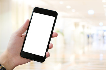 Hand using smart phone with blank screen over blur bokeh light background, business and technology, internet of things concept