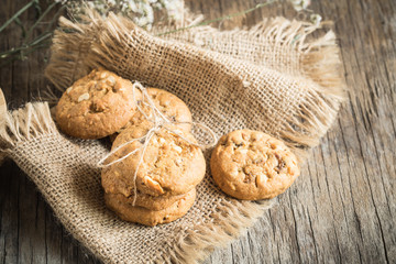 Homemade cookies on sackcloth on old wooden table