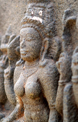 Closeup of ruins of ancient Hindu goddess stone carving in a temple