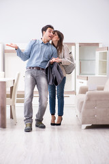 Married couple in the shop choosing furniture