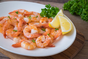 Fried shrimp with lemon on plate