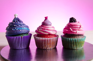 Three beautiful cupcakes studio shot 