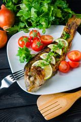 Fried fish served on the plate