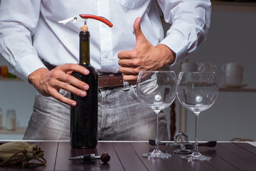 Professional sommelier tasting wine in restaurant