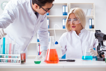 Two chemists having discussion in lab