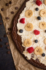 Brownie Dessert Pizza Topped with Fruits and Cream Cheese Frosting