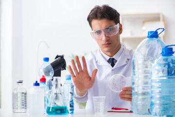 Fototapeta premium Lab assistant testing water quality