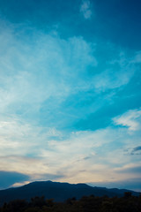  blue sky and mountain in background.
