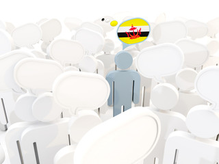 Man with flag of brunei in a crowd