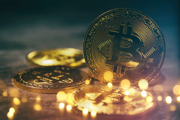 Golden Bitcoin over black background. Business concept.