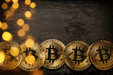 Golden Bitcoin over black background. Business concept.