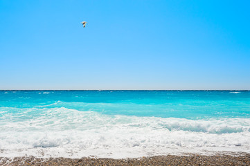 Turquoise sea and the blue sky. Beautiful beach in Nice, France.
