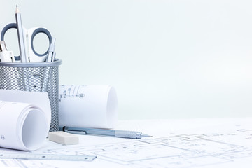 workplace of architect. engineering and drawing tools, construction blueprints on wooden desk 