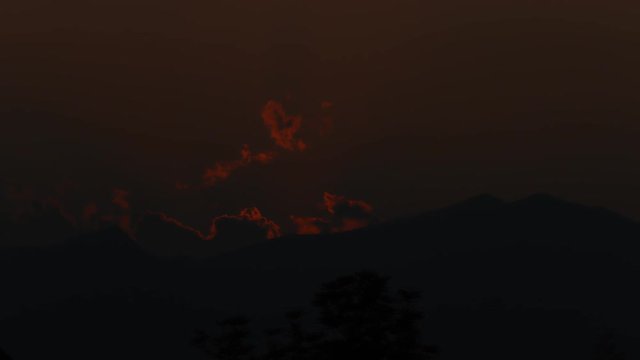 Timelaspse of Sunset with clouds over mountain. 4K, Ultra HD video clip