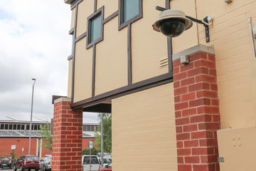 a dome security camera and surveillance system installed in a public car park © Kim Britten