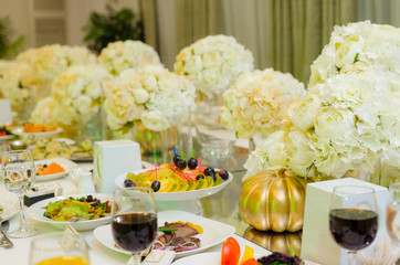 Beautiful holiday table setting in white and gold color