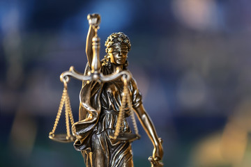 The Statue of Justice on defocused background. Selective focus