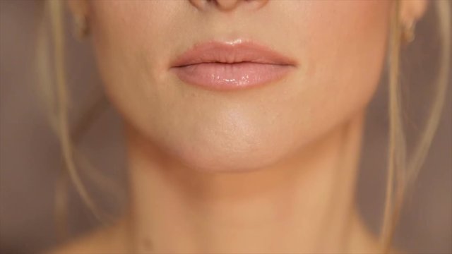 Women's lips, painted with light pomade