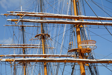 Fototapeta premium A sunny blue sky and a mast of a sailing ship