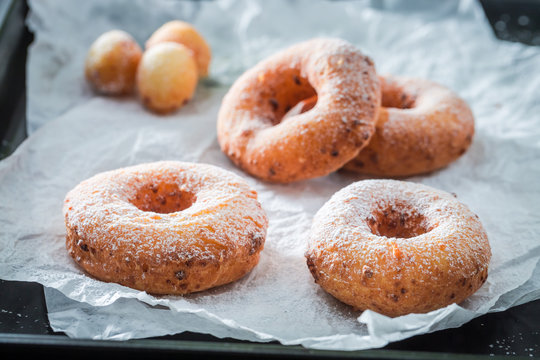 Clouseup of sweet golden donuts with sugar ready to eat