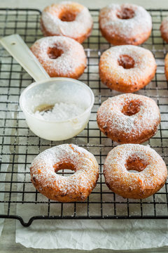 Sweet homemade donuts with powdered sugar ready to eat