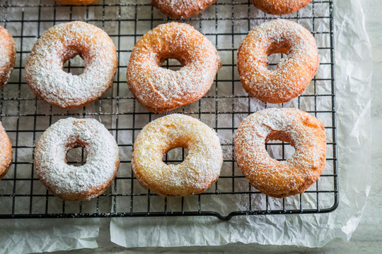 Closeup of homemade sweet donuts with powdered sugar