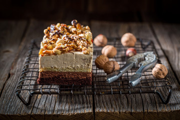 Tasty chocolate cake with walnuts and moouse