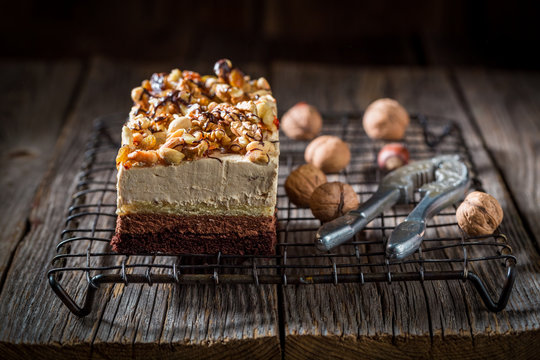 Tasty chocolate cake with walnuts and moouse