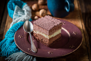 Rustic chocolate cake with hot cocoa in winter