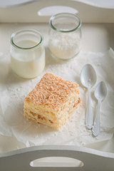 Sweet coconut cake with nuts and foam