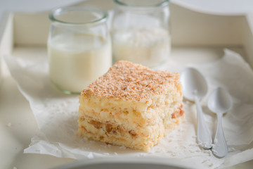 Tasty coconut cake with nuts and foam