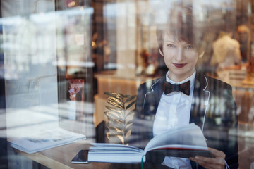 A young pretty girl reading a book