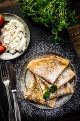 Crepes with strawberries and cream