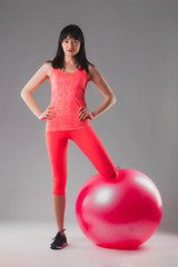 Fototapeta na wymiar cute brunette woman doing exercises with fitball.