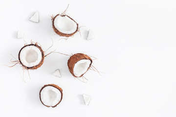 Coconut background. Fresh coconuts on white background. Flat lay, top view, copy space