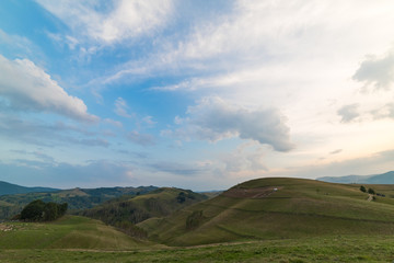 Beautiful mountain landscape with trees and a cloudy morning sky, Dumesti, Salciua, Apuseni, Romania
