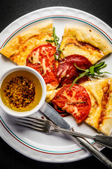 Pizza with salami and vegetables 