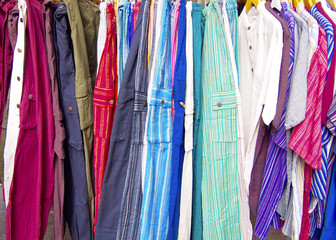 Group of pants and shirts in the store
