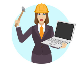 Businesswoman in construction helmet trying to break a laptop notebook with a hammer