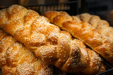 freshly baked bread and baked goods on the shelves on the counter of the bakery