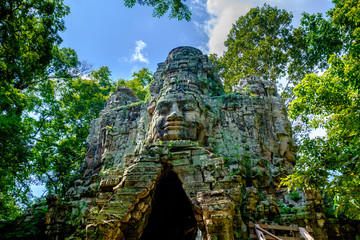 Giant face on the entrance to Angkor Thom, Angkor, Cambodia