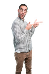 Cool young man pointing with his hand