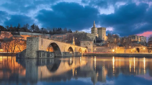 View on Pont d'Avignon 12th century bridge and city skyline in Avignon, Provence, France (static image with animated sky and water)
