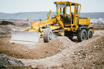 Obraz premium highway construction site with motor grader, excavator and bulldozer working