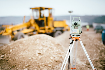 Surveyor equipment GPS system or theodolite outdoors at highway construction site. Surveyor...