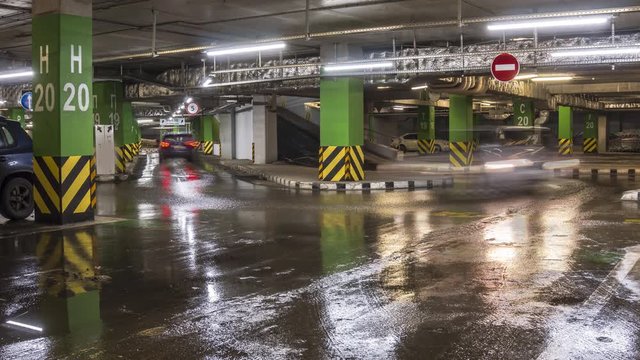 motion of cars at entrance and exit in underground shopping mall parking  time lapse
