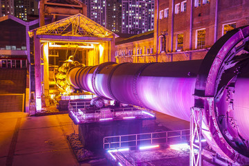 Factory buildings and industrial equipment in the evening