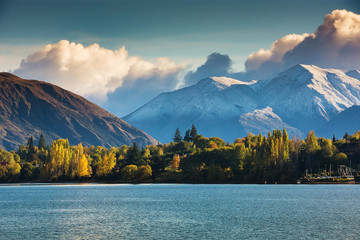 First snow in Wanaka, south island, New Zealand with colorful tree, mountain and lake.
