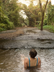 Fototapeta premium woman sitting alone in lake peachful relaxation with nature travel destination journey to meditation